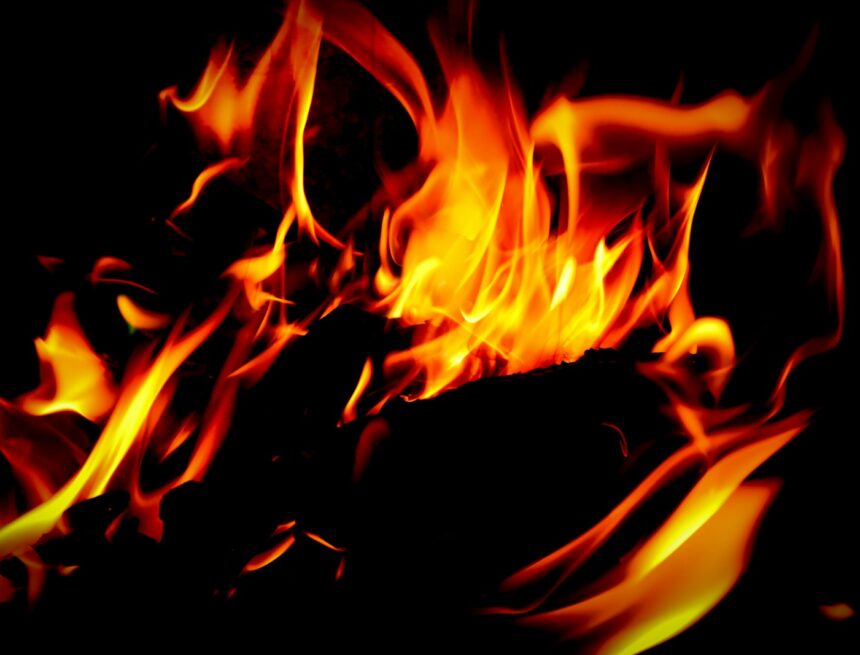a close up of a fire in the dark