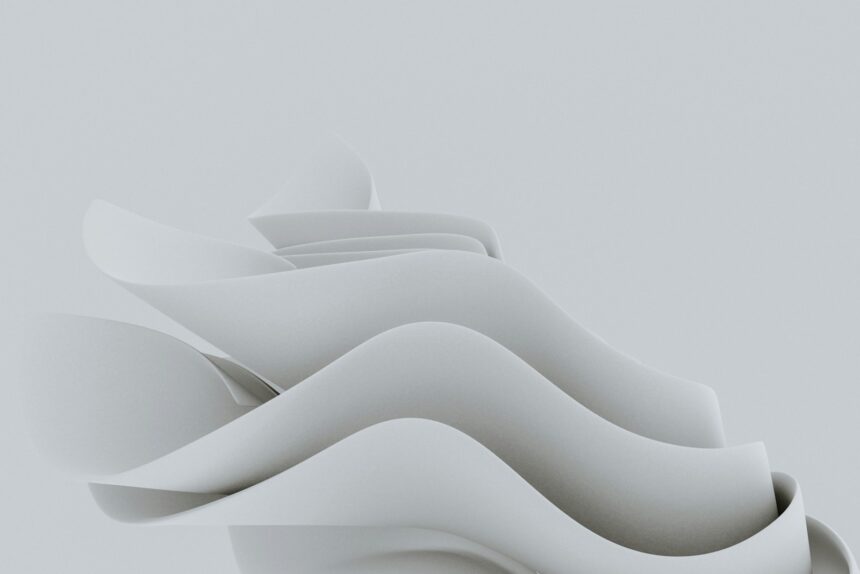 Photo by Pawel Czerwinski a white object with wavy shapes on a gray background